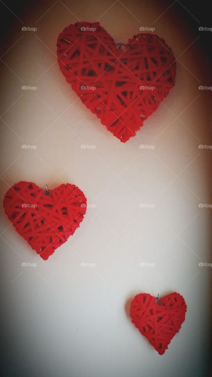Red Hearts. photo of some wooden hearts that I painted red and hung on our wall