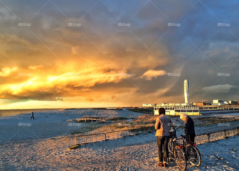 Two girls standing on beach