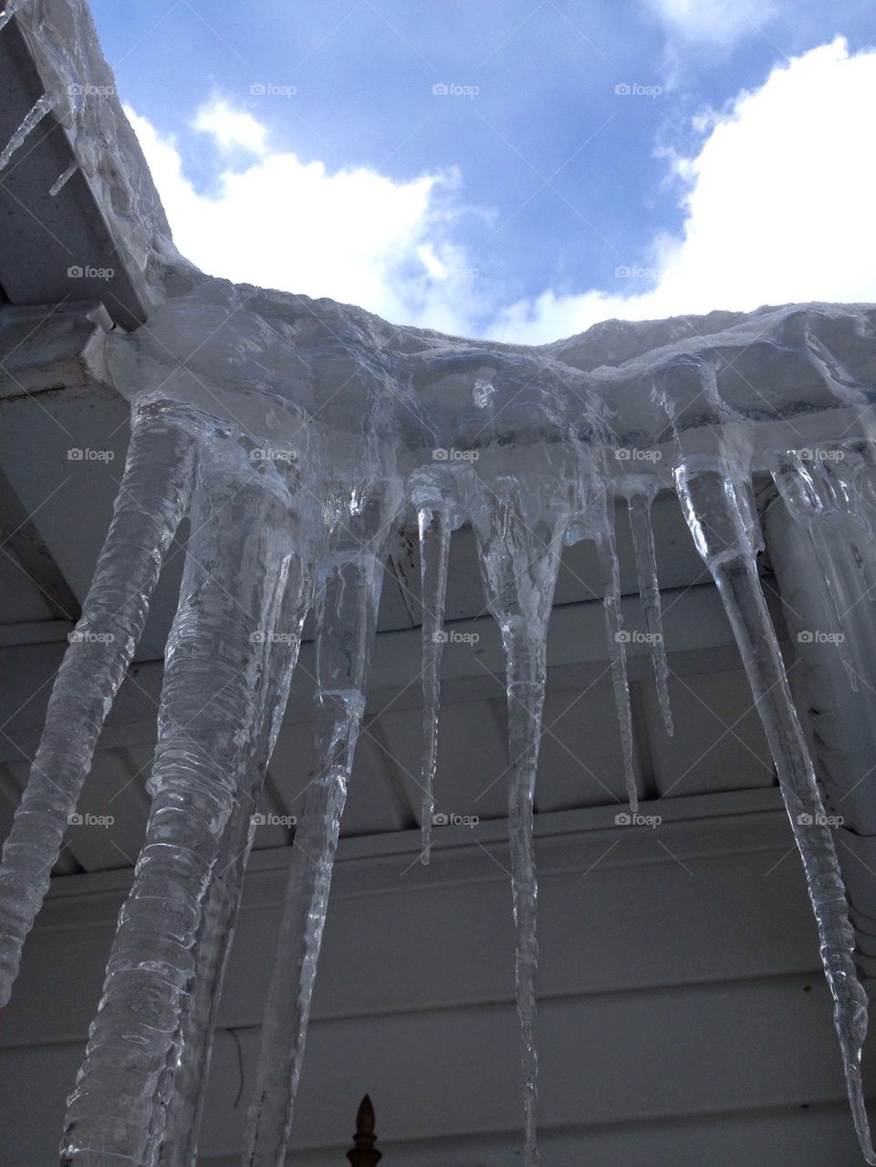 Ice Dam   Icicles   Blue Sky Clouds