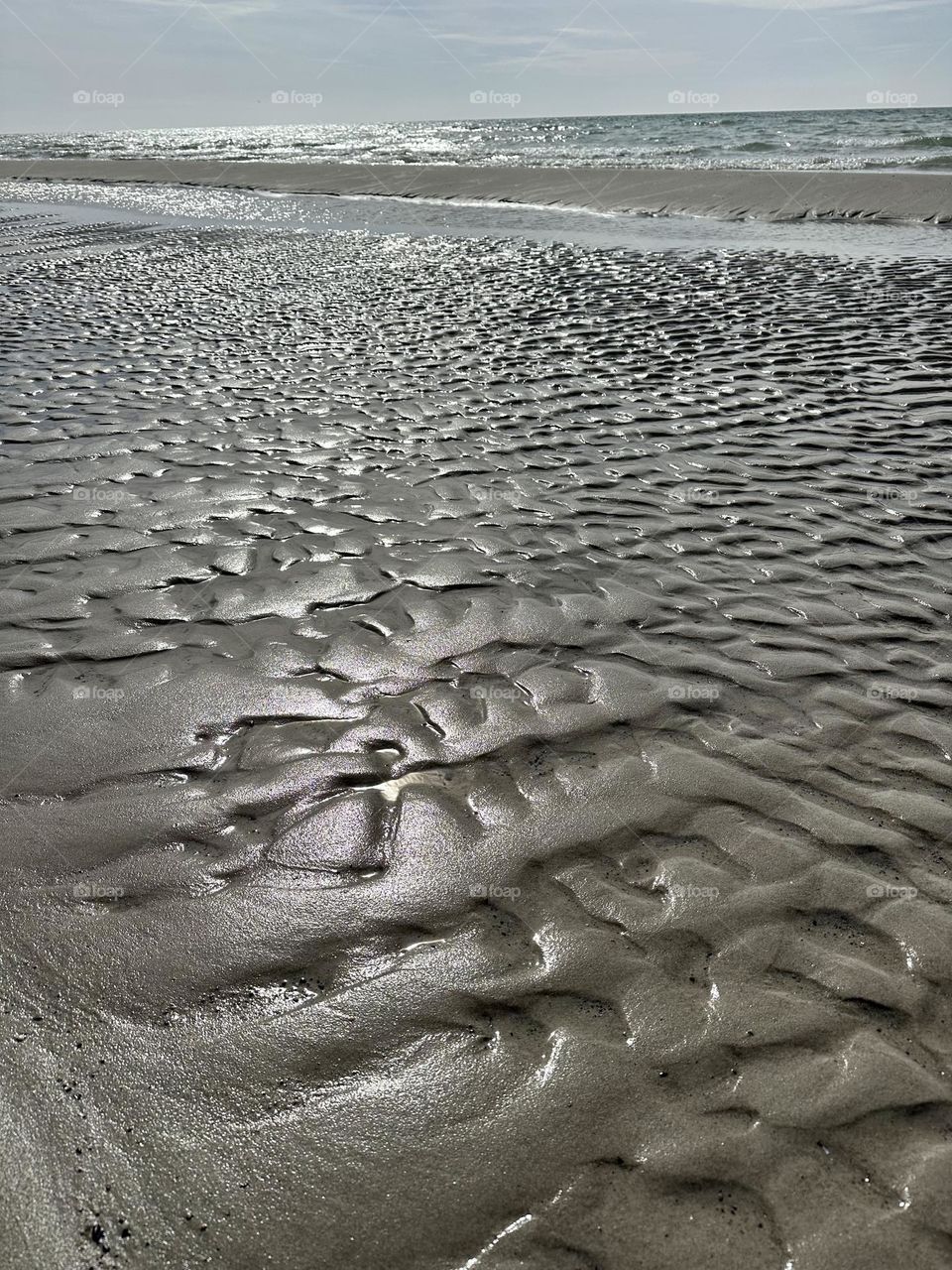 Wet sand on the beach