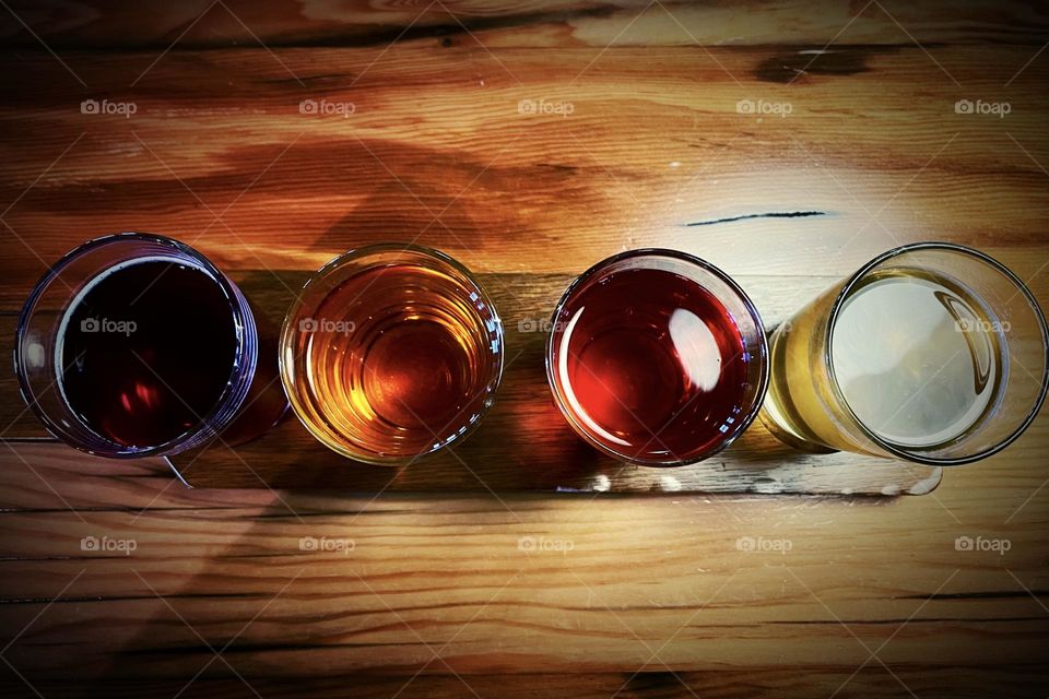 Cider sampler tray on a hardwood table