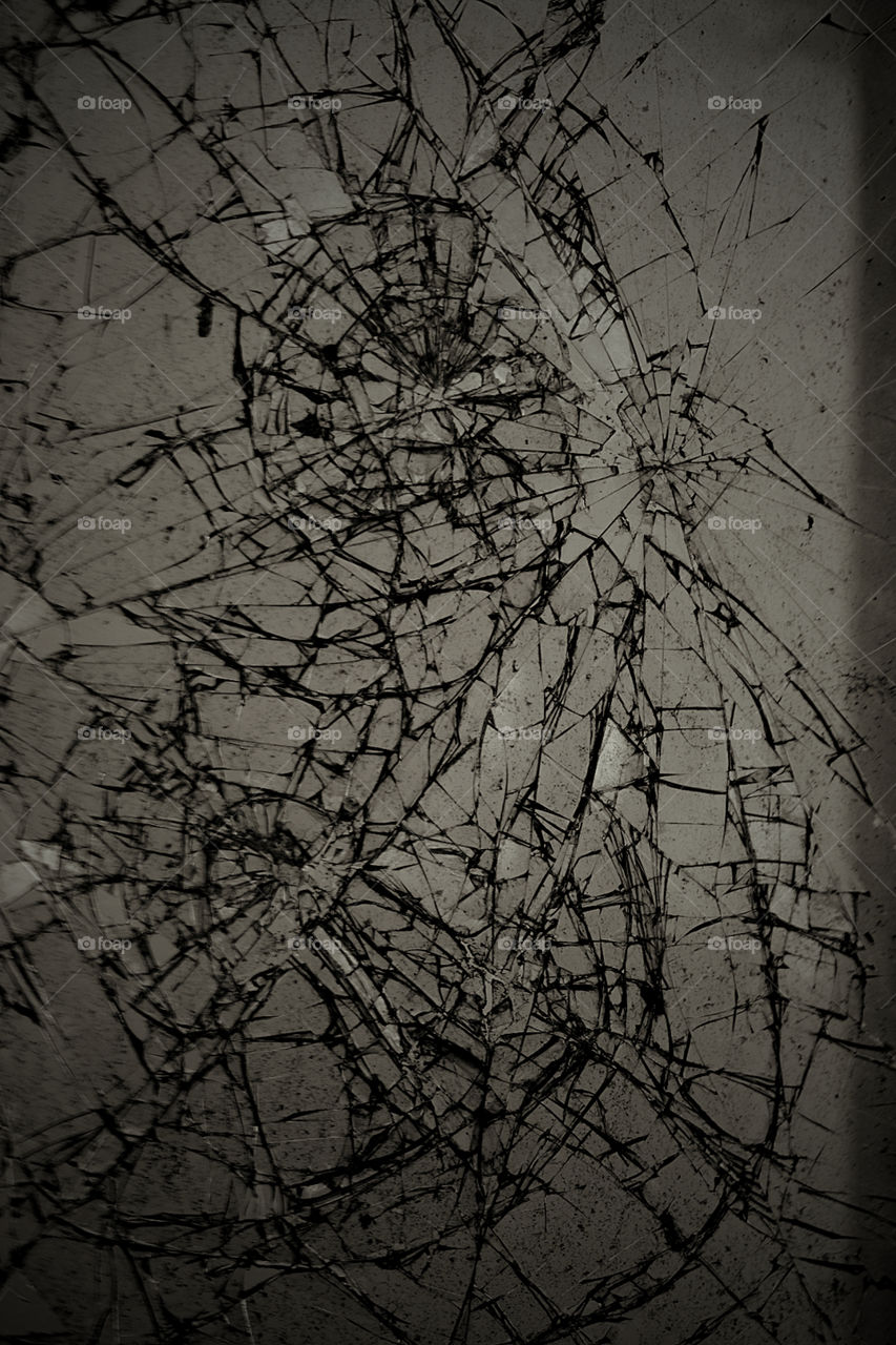 Monochromatic Cracked Window In Abandoned Hotel