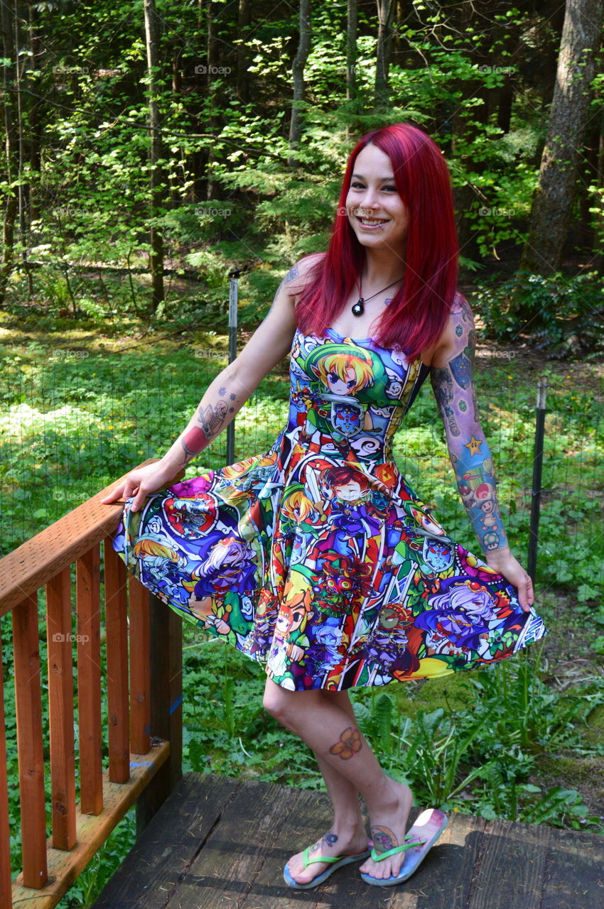 Woman with dyed hair posing in patio
