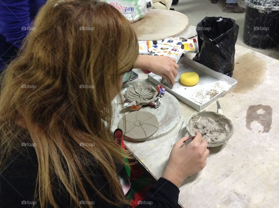 Making ceramic art.  