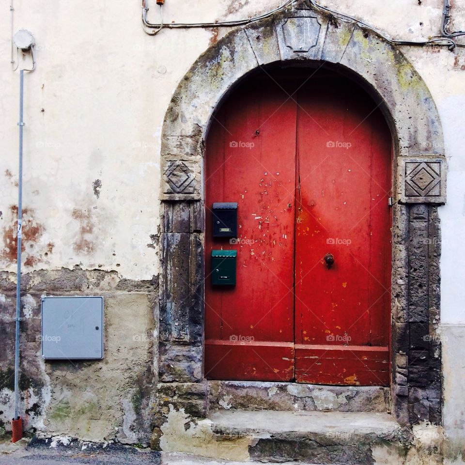 Old red door. Italian door in Napoli