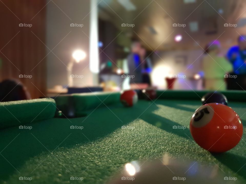 playing a game of pool