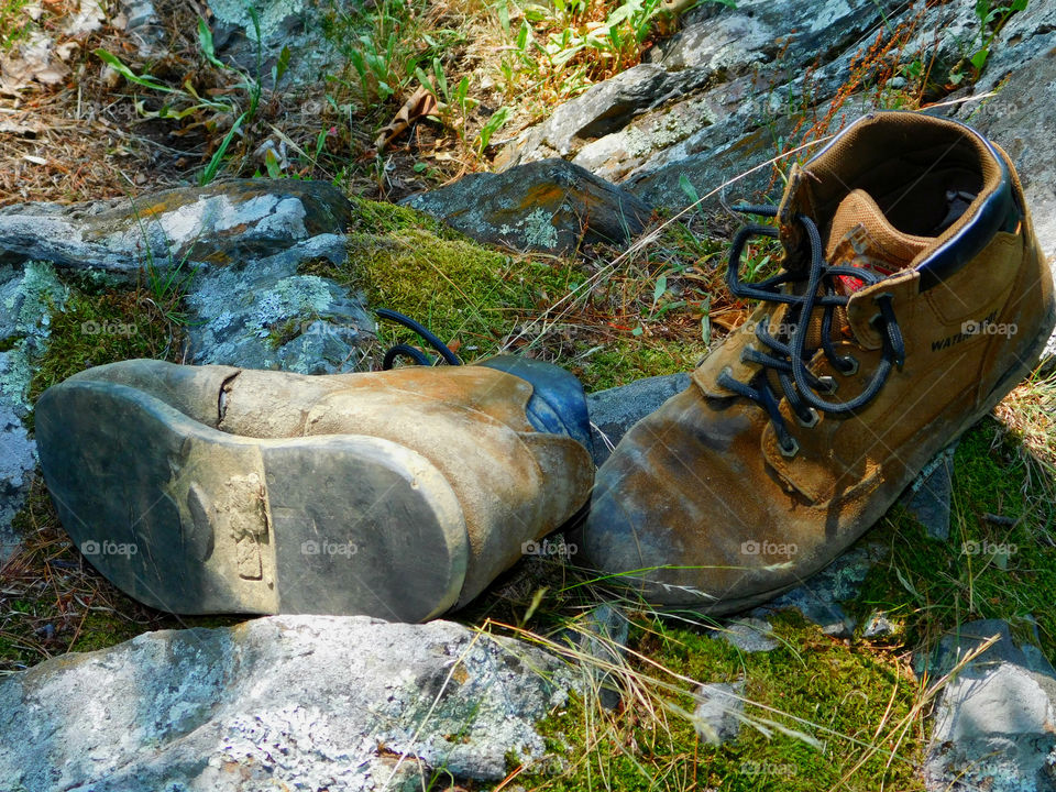 The boots were old. The leather had since cracked and aged. The toes were scuffed and they were falling apart at the seams. The boots had long lived their life of travel,work,joy, and love. After their final journey, it was time to throw them away. It was hard to say GOODBYE!