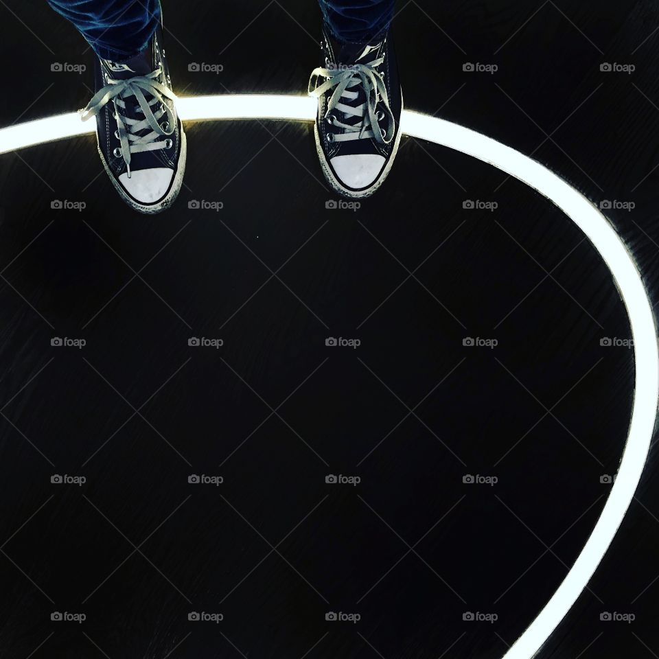 Standing on a neon ring
