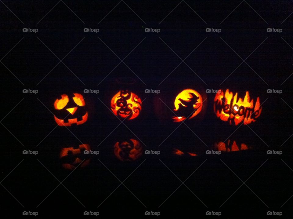 The results of a pumpkin carving contest amongst friends.
