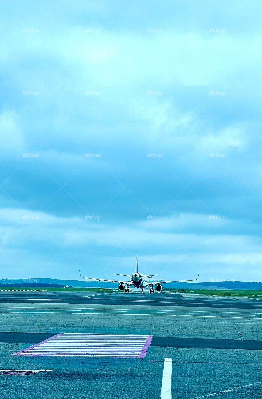 Airplane on the runway in the evening