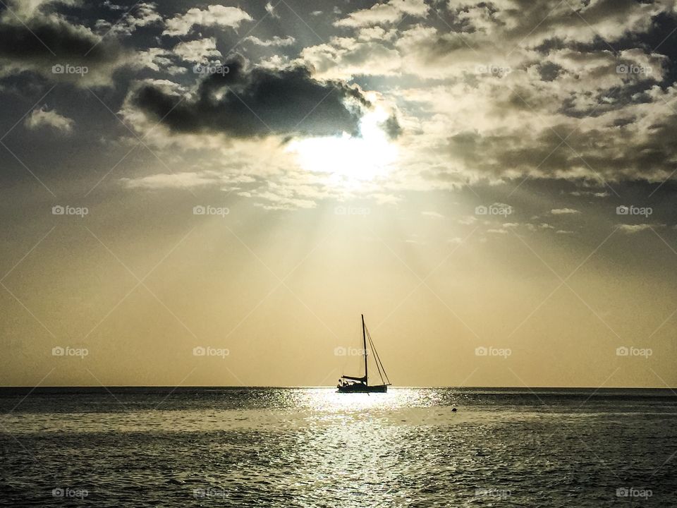 Sun rays on sailboat 