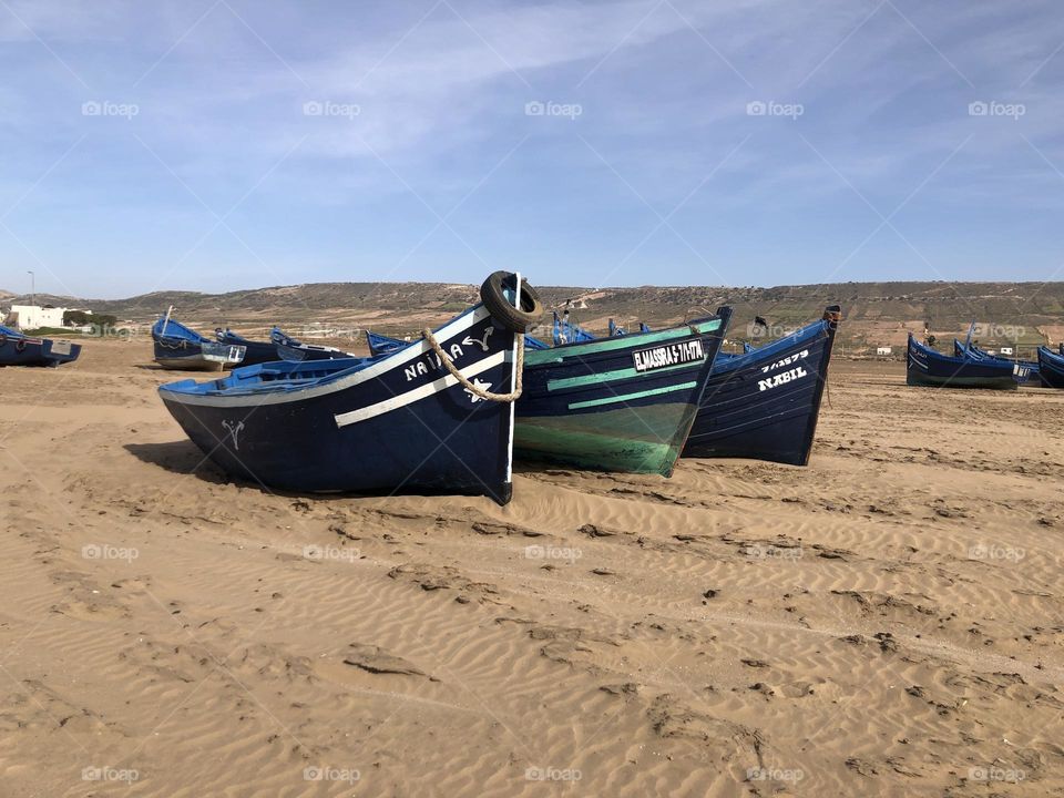 Beautiful boats on the sand near the beach at essaouira city in morocco.