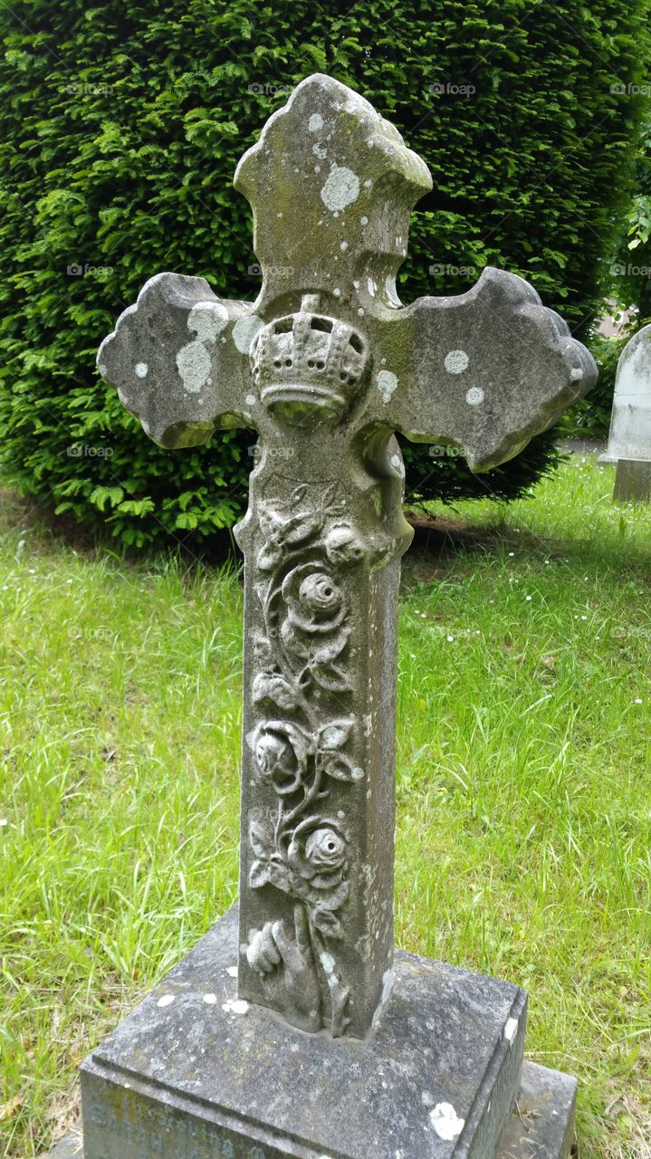 stone cross hand carved with roses. 120 years old grave
English cemetery
100 + years old graves
Some people think graveyard and cemetery mean the same, but, if we want to be a little nitpicky, we should say that graveyard is a type of cemetery, but a cemetery is usually not a graveyard. To understand the difference, we need a little bit of history.
From about the 7th century, the process of burial was firmly in the hands of the Church (meaning the organization), and burying the dead was only allowed on the lands near a church (now referring to the building), the so-called churchyard. The part of the churchyard used for burial is called graveyard, an example of which you can see in the picture.
As the population of Europe started to grow, the capacity of graveyards was no longer sufficient (the population of modern Europe is almost 40 times higher than it was in the 7th century). By the end of the 18th century, the unsustainability of church burials became apparent, and completely new places, independent of graveyards, were devised—and these were called cemeteries.
The etymology of the two words is also quite intriguing. The origin of "graveyard" is rather obvious; it is a yard filled with graves. However, you might be surprised to hear that "grave" comes from Proto-Germanic *graban, meaning "to dig", and is unrelated to "gravel".
Of course, the word "cemetery" did not appear out of the blue when graveyards started to burst at the seams. It comes from Old French cimetiere, which meant, well, graveyard. Nevertheless, the French word originally comes from Greek koimeterion, meaning "a sleeping place". Isn't that poetic?
