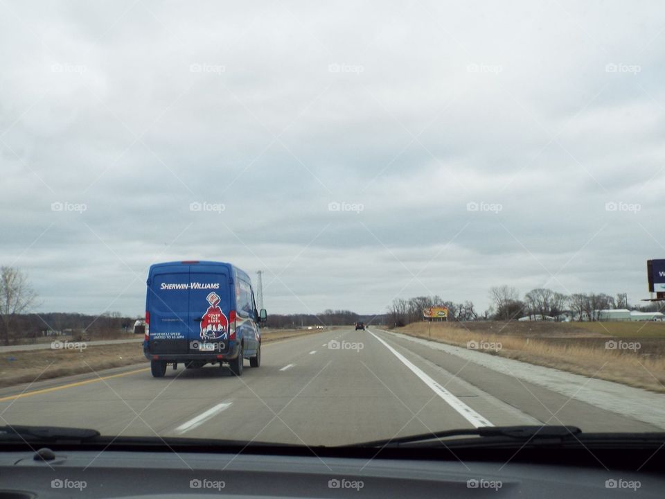 Bisness van driving down the highway 