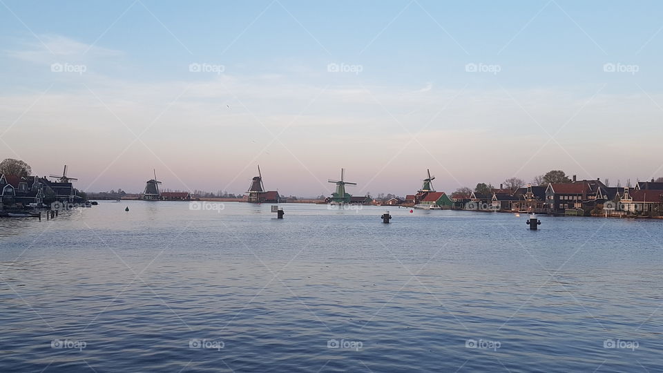 Sunset near the Zaans Museum with its windmills in background. Netherlands.