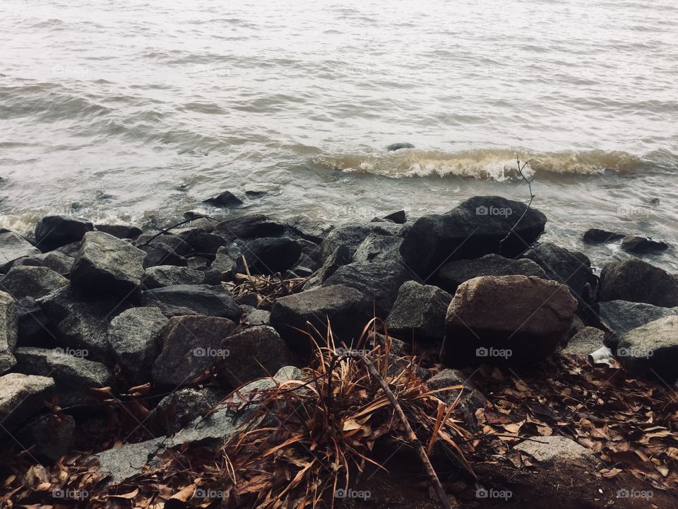 Waves crashing into rocks. 