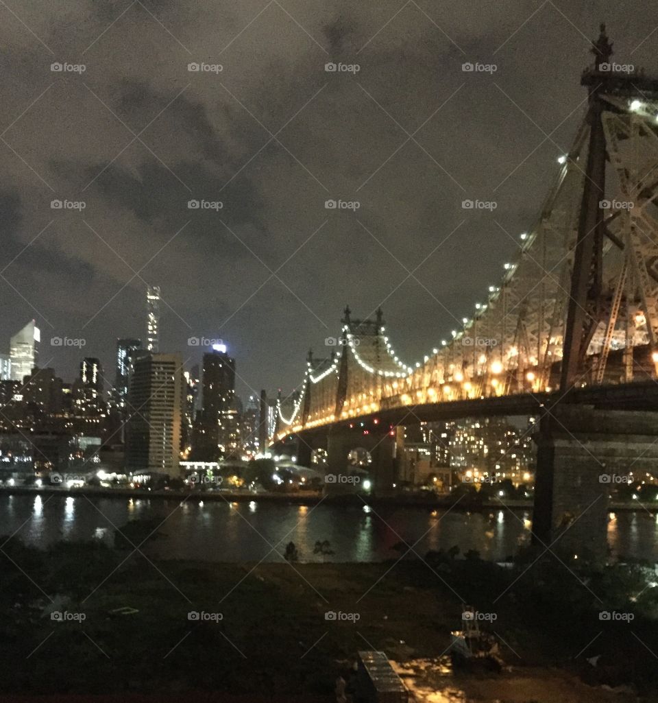 New York City Bridge at night slightly cloudy.   Ed Koch Bridge.  Queensboro Bridge