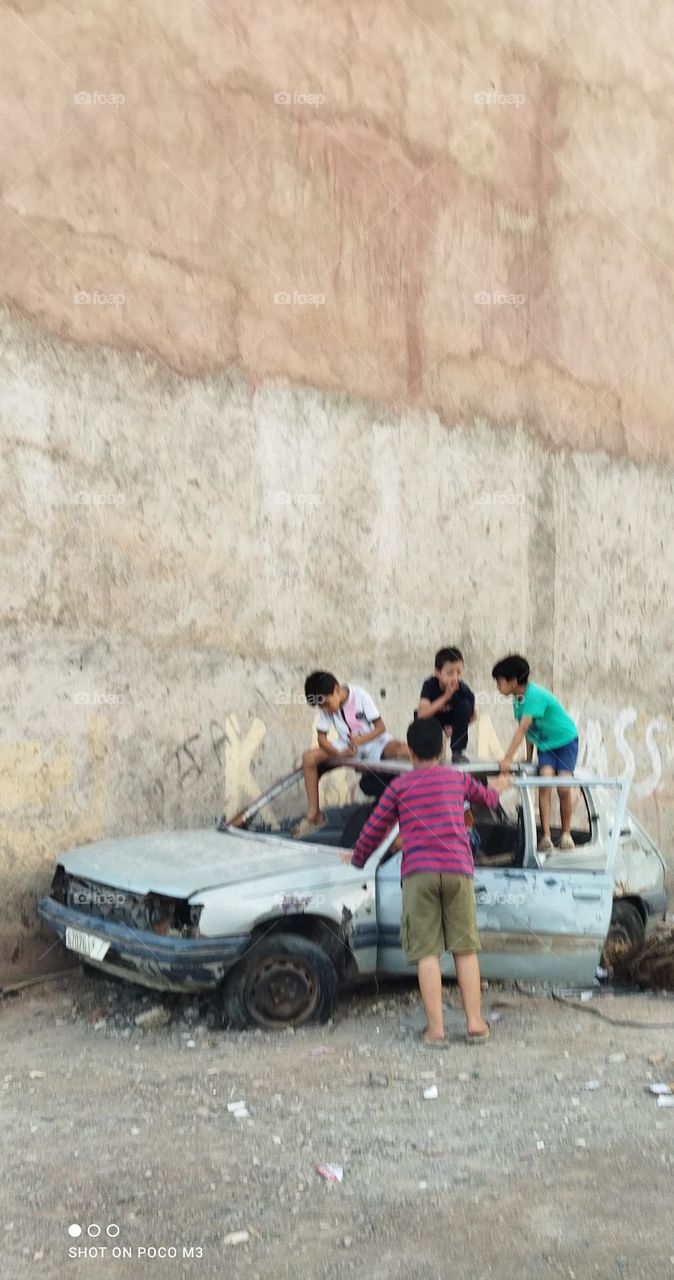 group of children on ancient car.