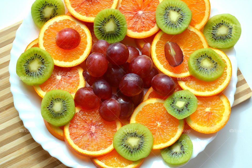 tropics fruits healthy food on a plate background