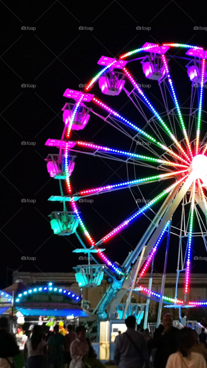 A colorful Ferris wheel. Not so clean but useful if used as a blurred background.