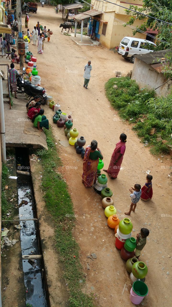 women waiting for water