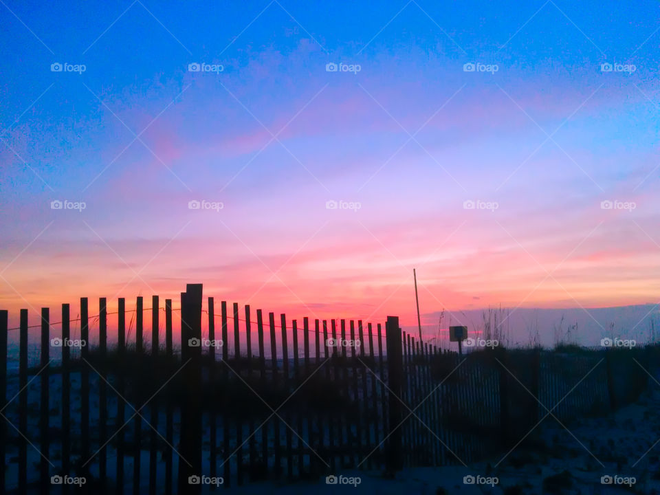 picket fence sunset