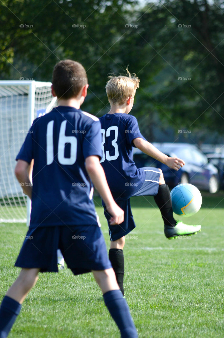 Boys playing a soccer game