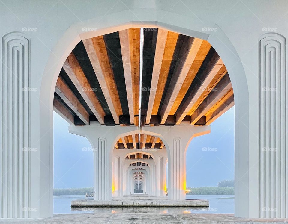 Beautiful architecture of arches under the bridge on a misty morning in Vero Beach Florida 