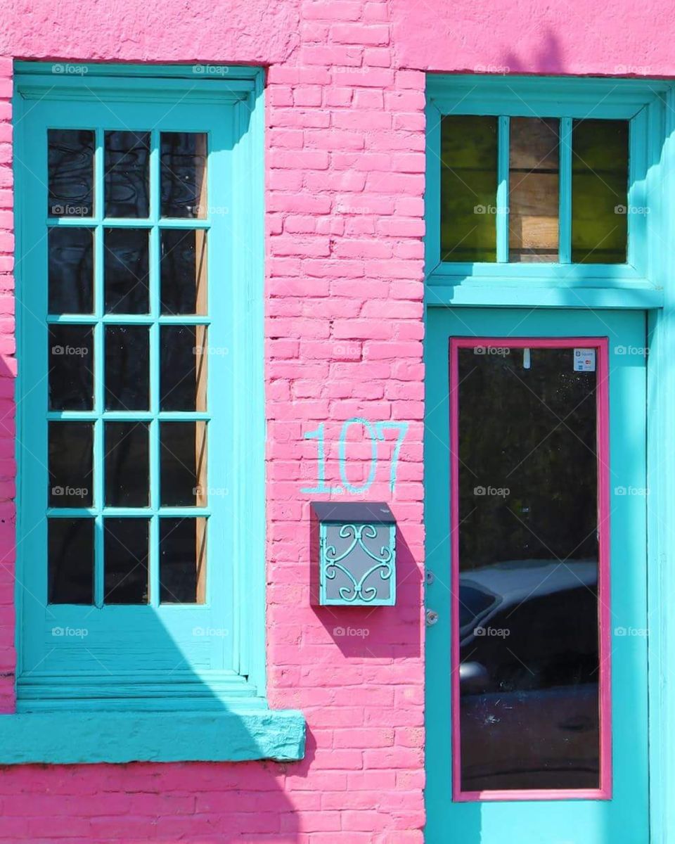 small town southern living vintage brick architecture pink paint