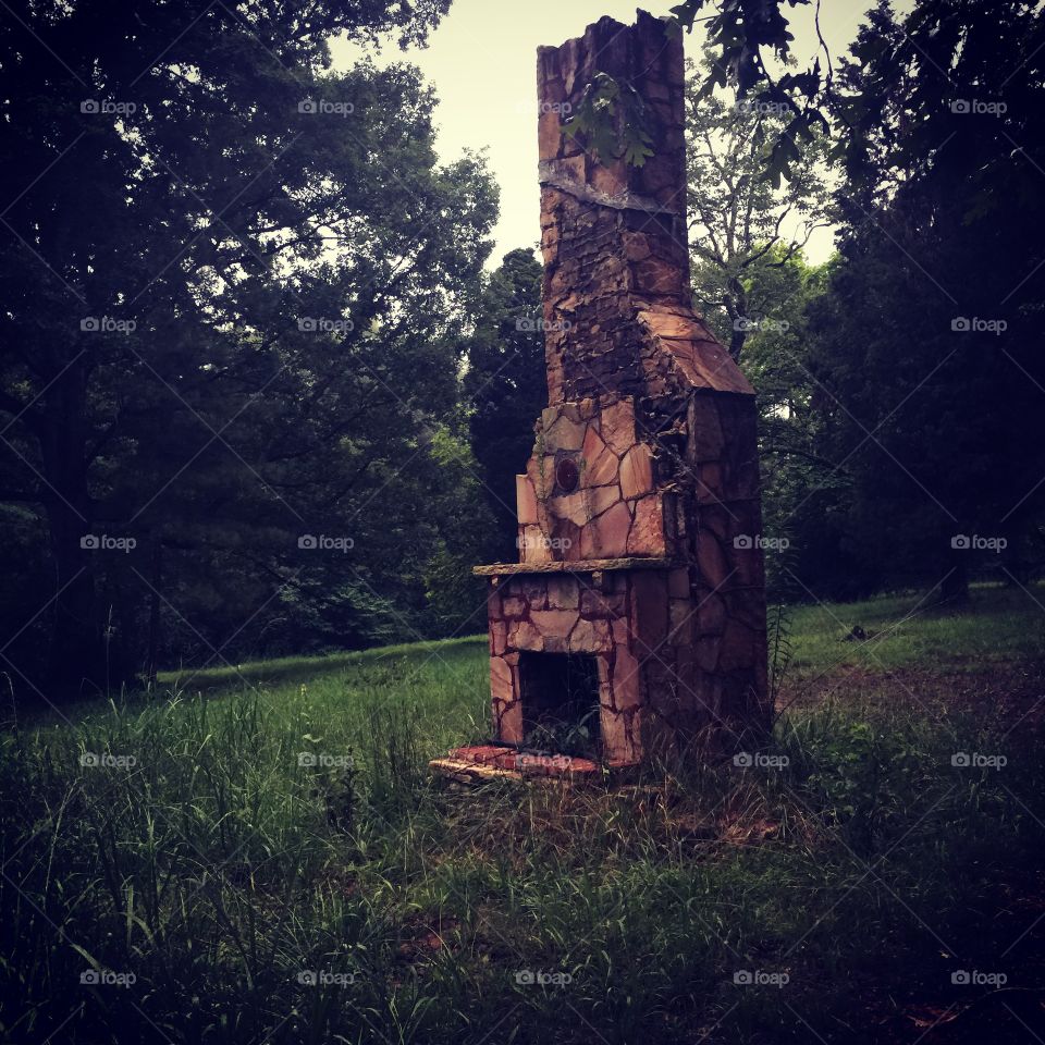 Hearth. Old chimney in the woods