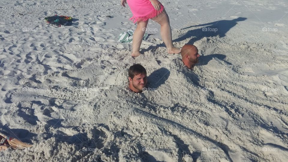 buried in sand in Destin Florida