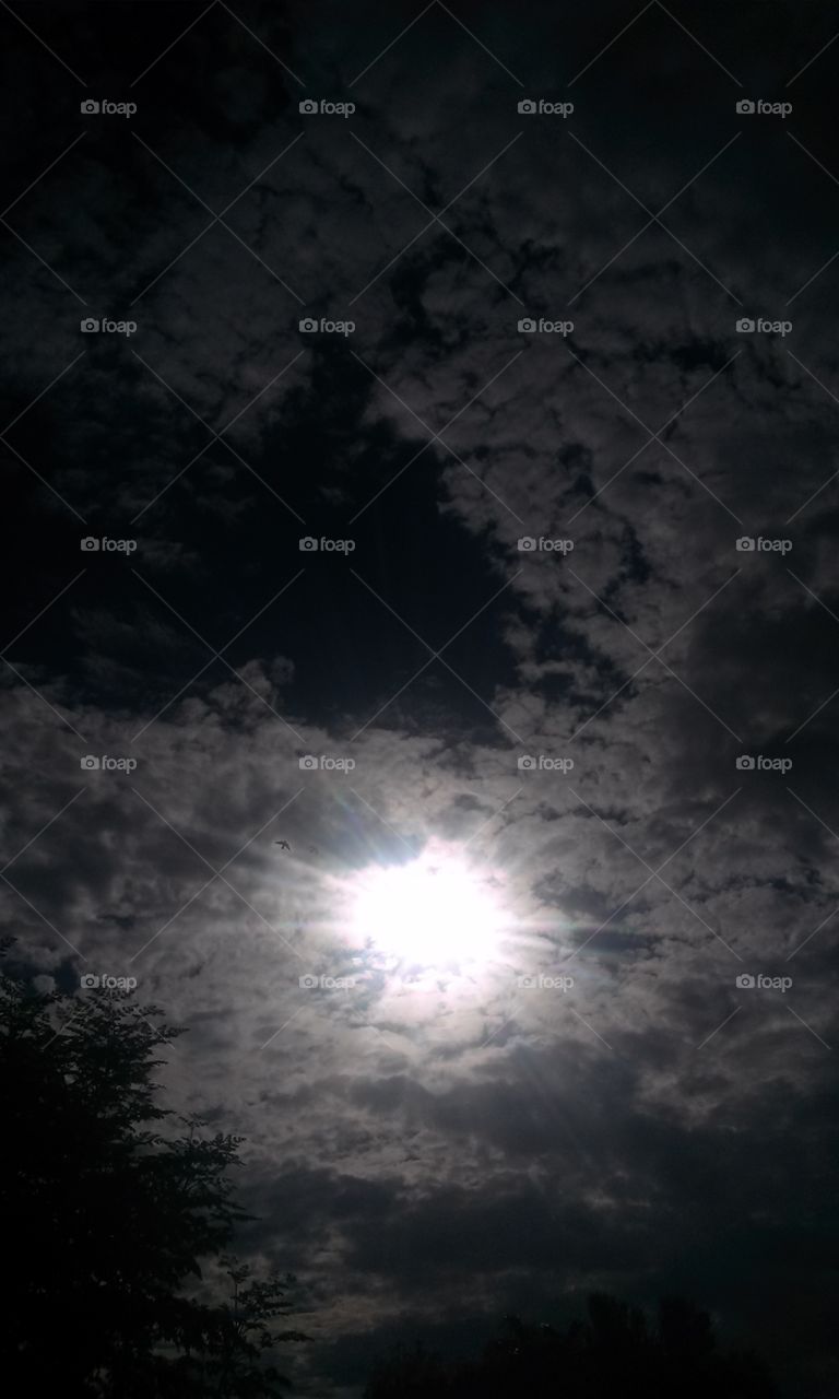 Sun light Beaming through Clouds a gleaming 
Storm clouds that is 
A picture  for sure 
I say Galore  should i ask
For much more .