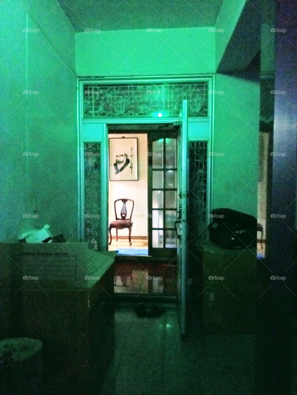 An empty chair in front of this open door.
It's simply a chair but there's a story behind it.
It's where my mom used to sit.
She loves that place and chair so much.
So everytime the chair is there, it means she's here and she's using it.