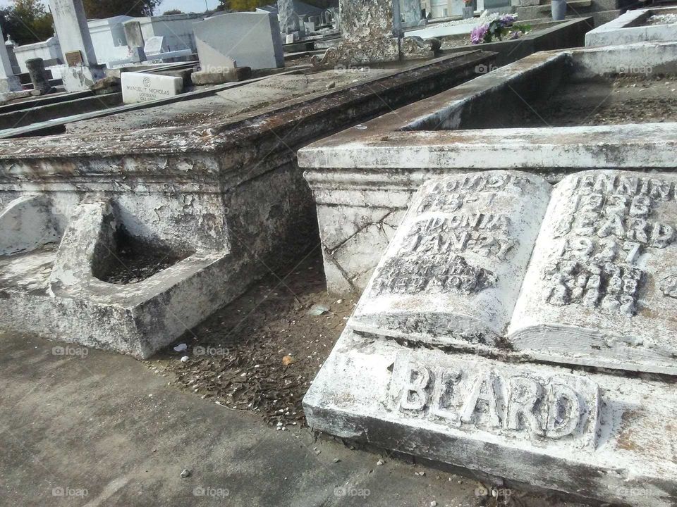 Marble gravesite marker. Craftsmanship is still brilliant today after almost a hundred years later. St Louis Cemetery New Orleans Louisiana