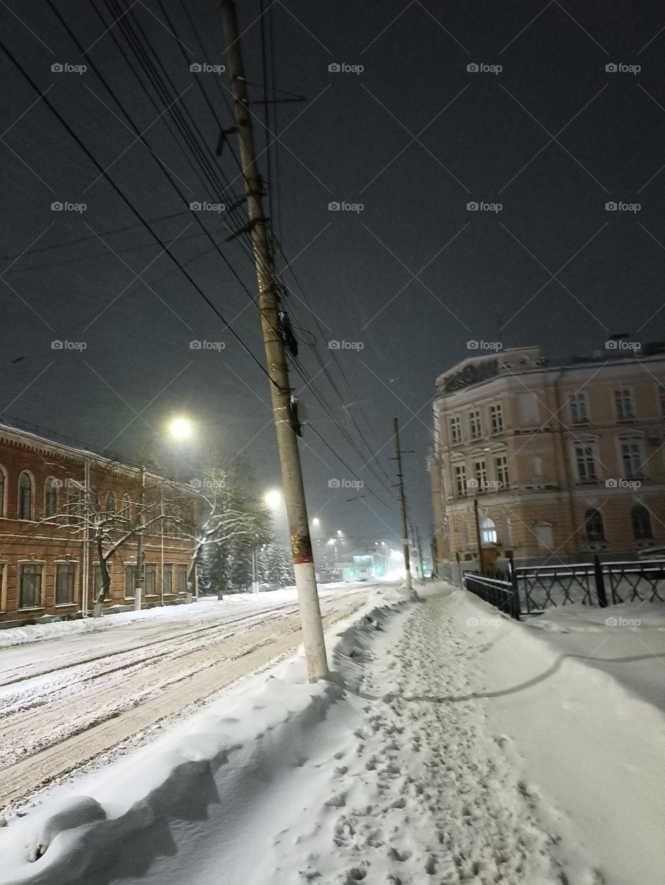 Evening city in the snow