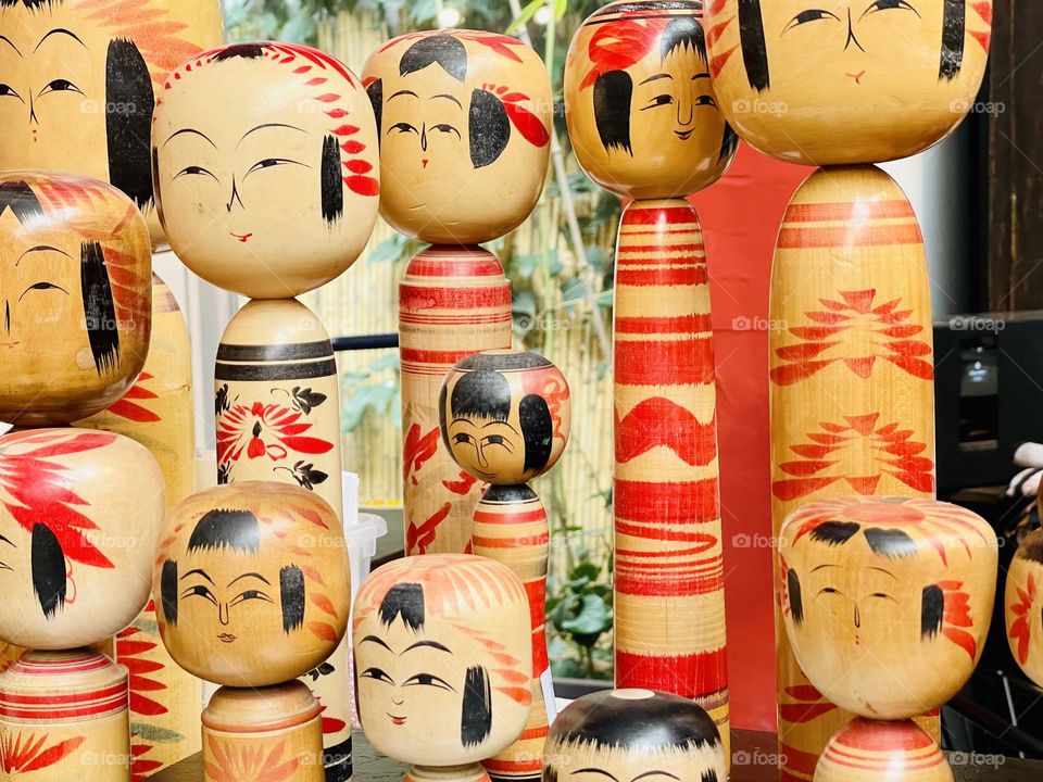 Assorted wood kokeshi dolls, engraved typical Japanese dolls, Japanese crafts, Japanese art and tradition 