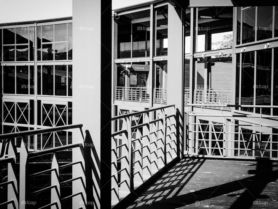 B & W architecture of metal and glass with shadows and highlights 
