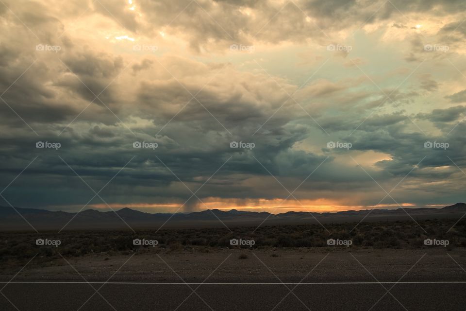 Scenic view of storm cloud at sunset