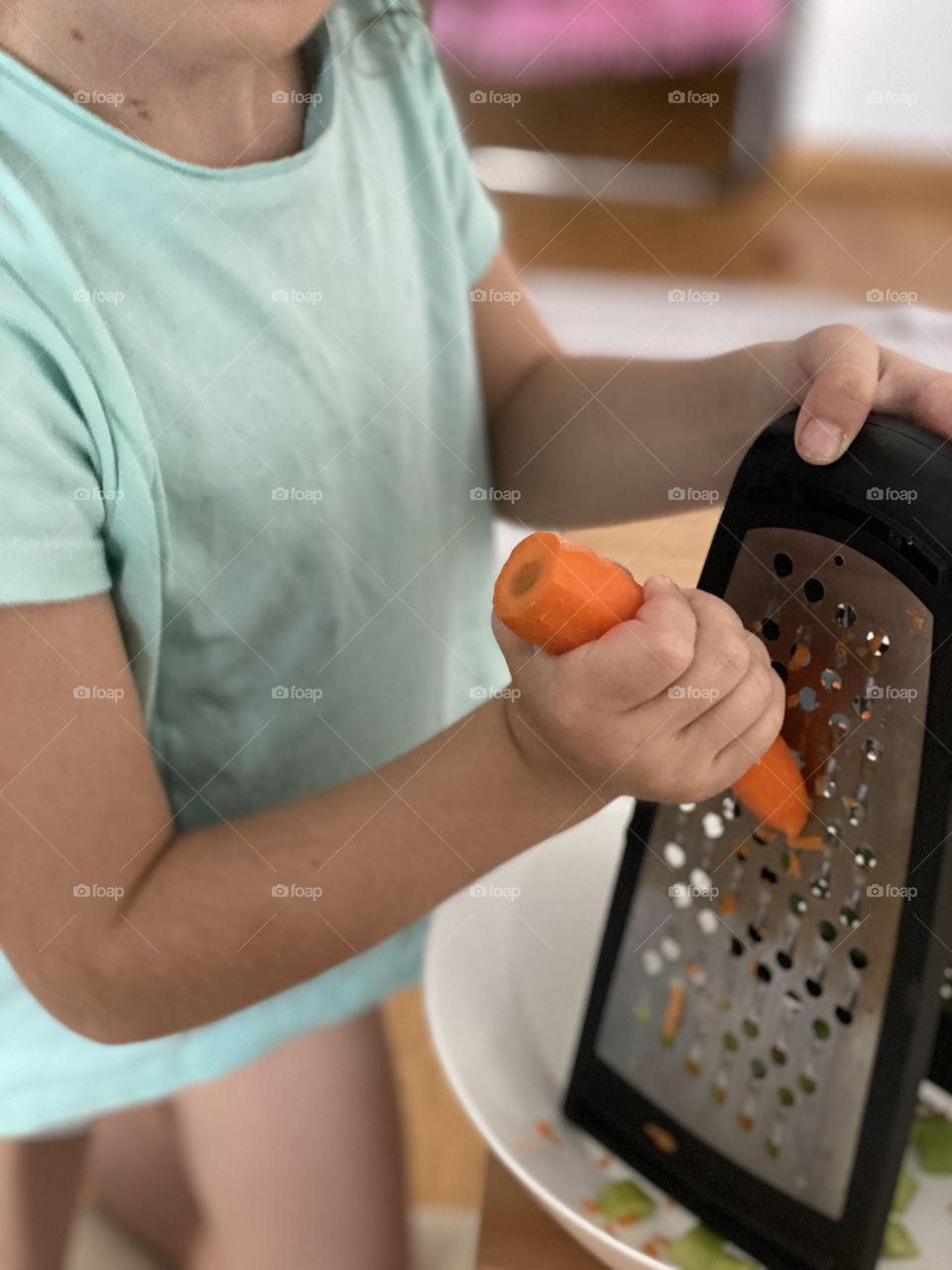 Tiny hands and carrot