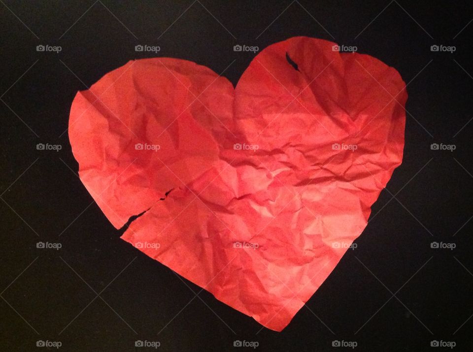 Ripped and crumpled red paper heart