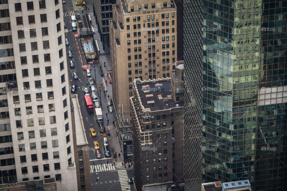 Street activity of Manhattan from an high level in a skyscraper of New York City