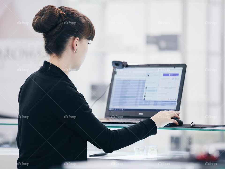 Woman working with laptop in the office