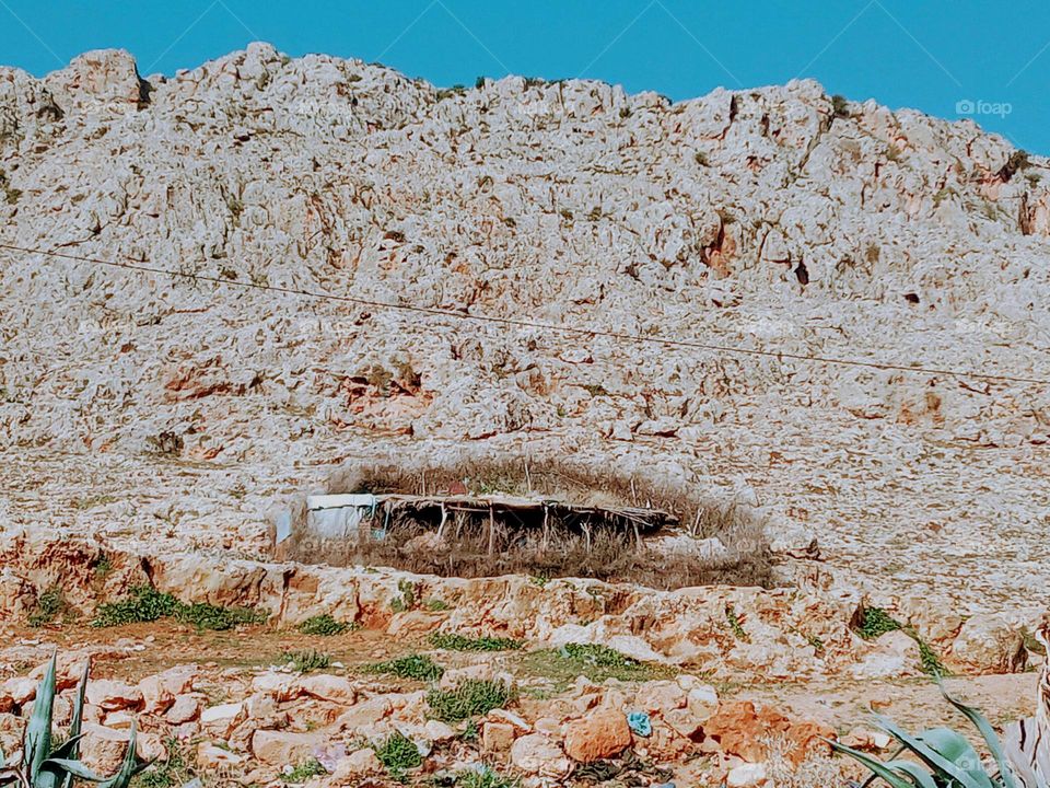 Acattle stable at the foot of the mountain