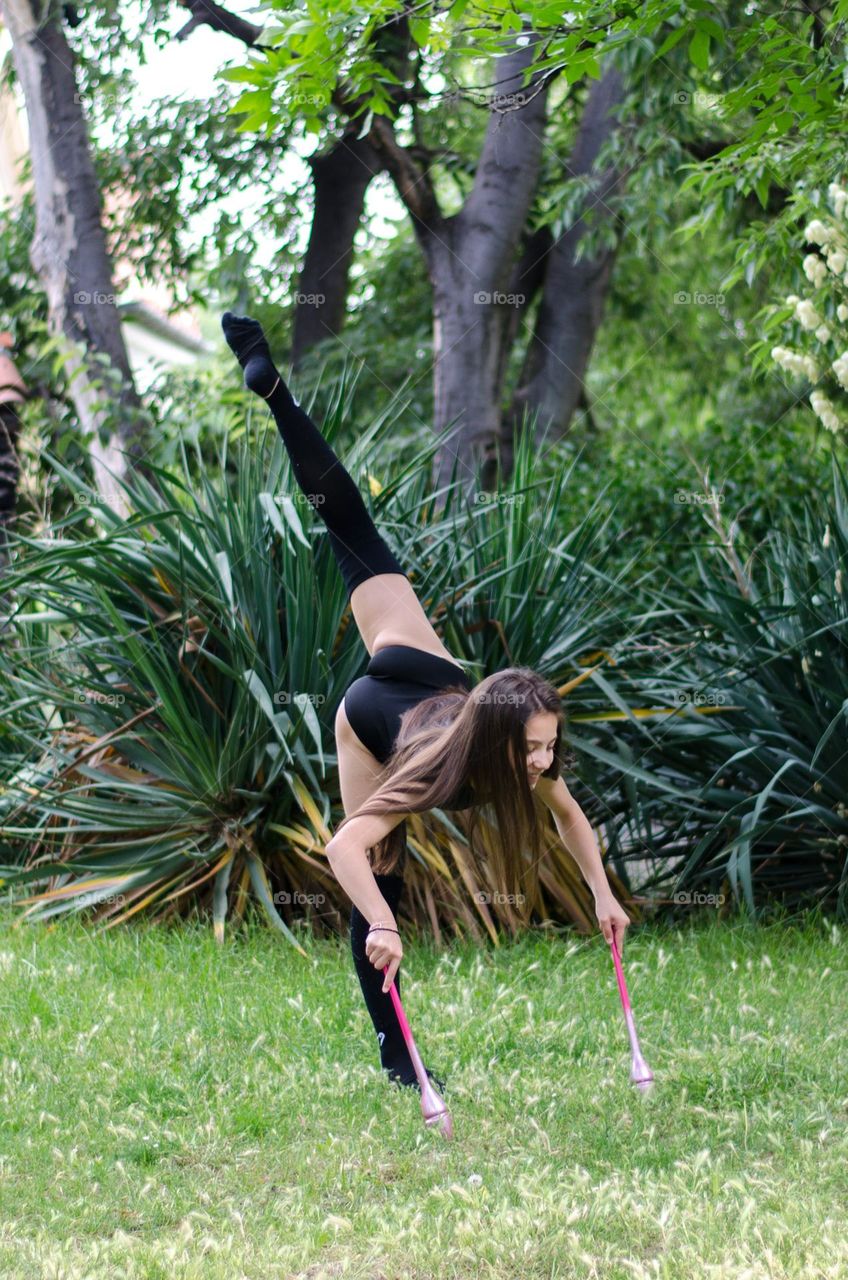 Beautiful Young Gimnast Dancing in Nature