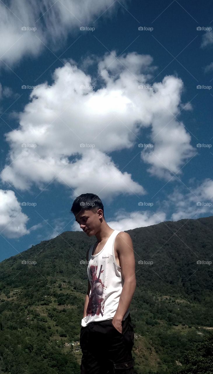Showing mine strong bones😁 front of great grassy Himalayas 🏞️ with white beutiful cloud