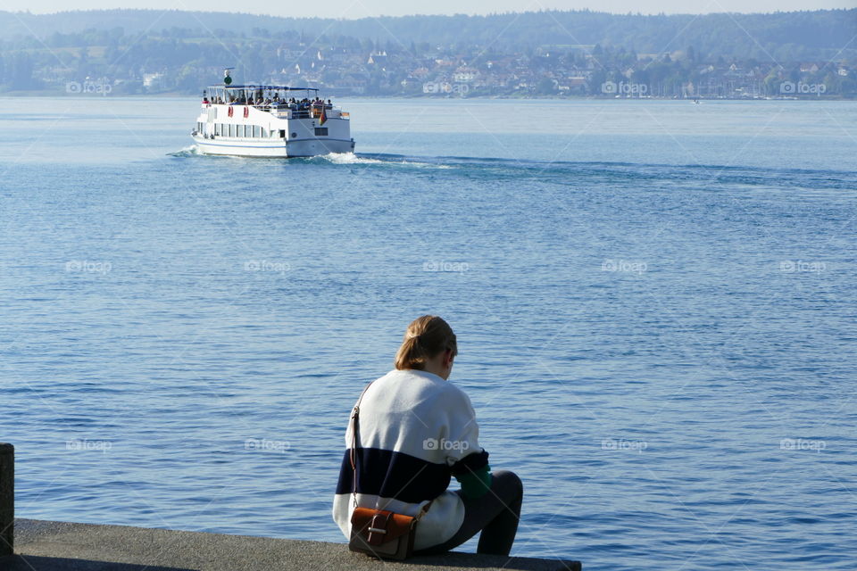 a lady sitting at port