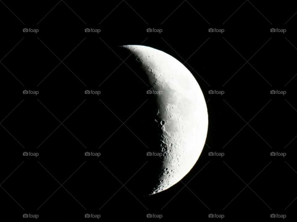 Crescent moon. Three-dimensional craters are well visible along the shadow line.