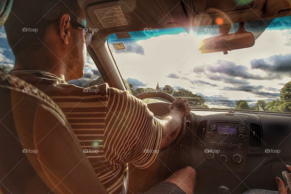 Man driving with sun light