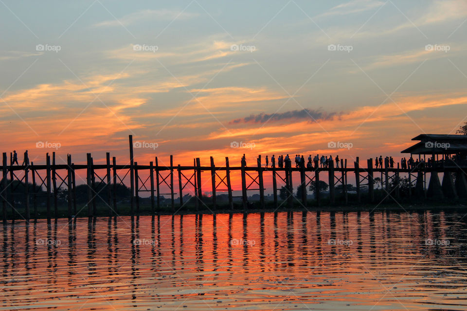 Silhouette of a people on pier during sunset