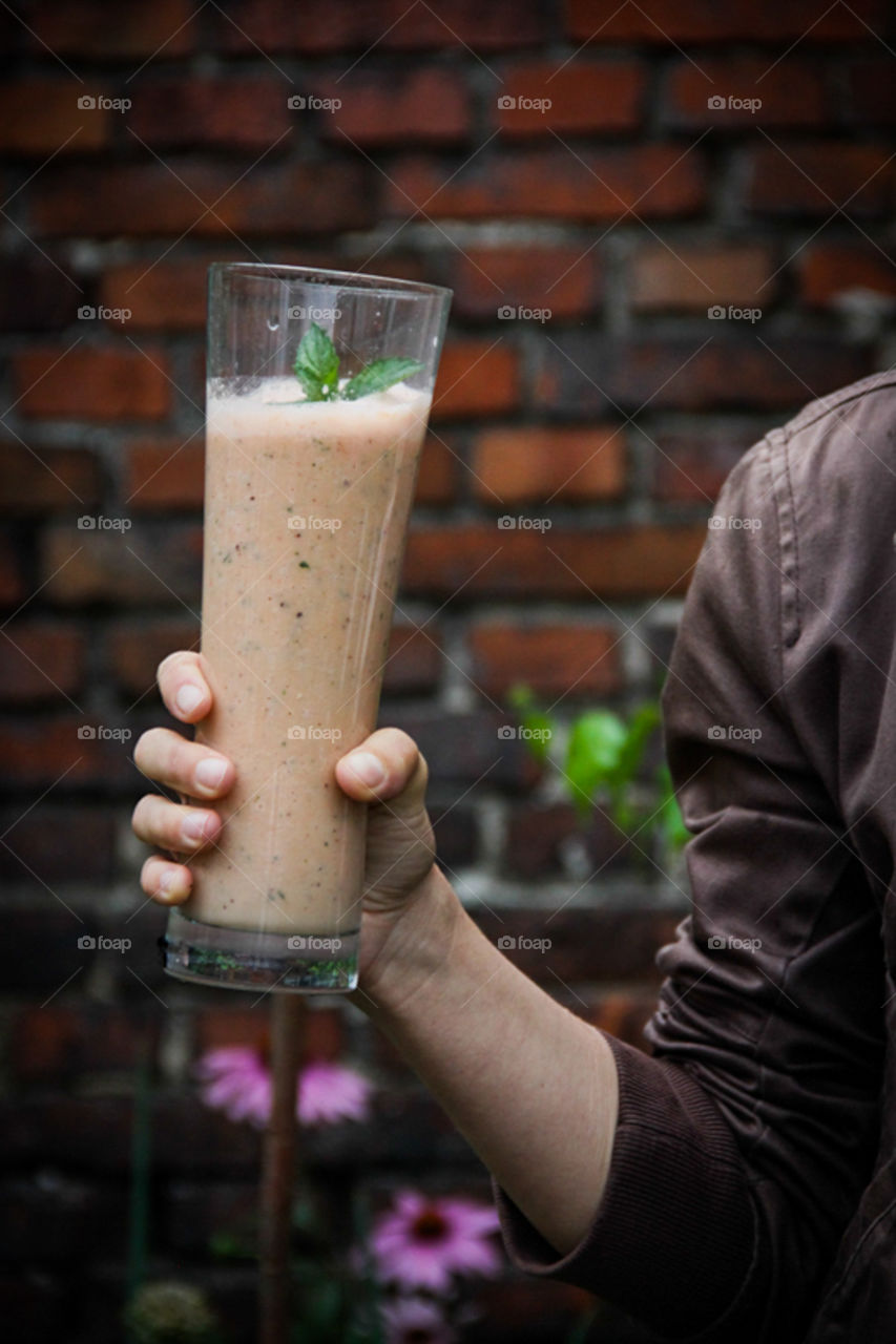 Man holding glass of cocktail